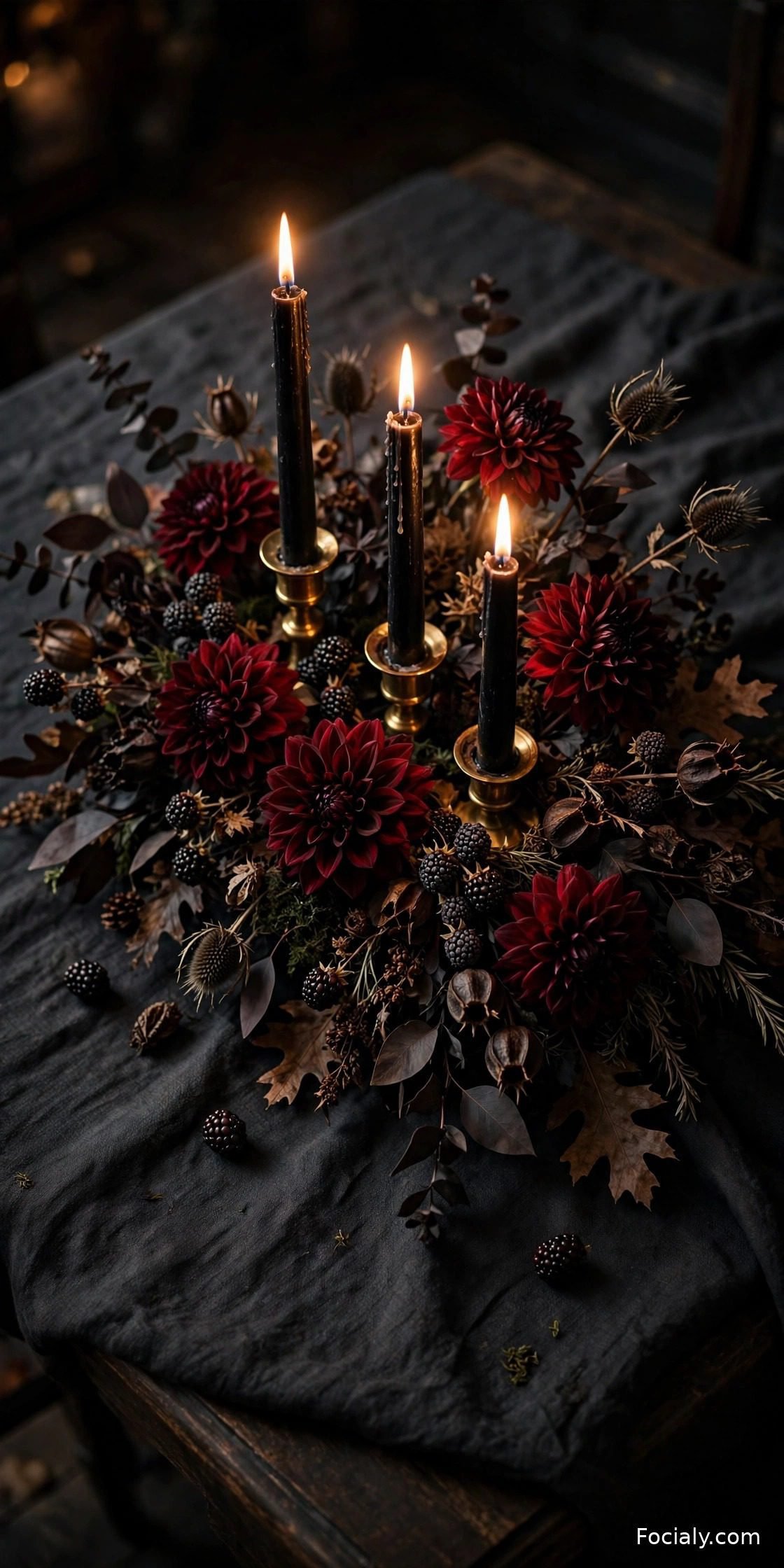 Moody dark fall tablescape with black candles and dahlias