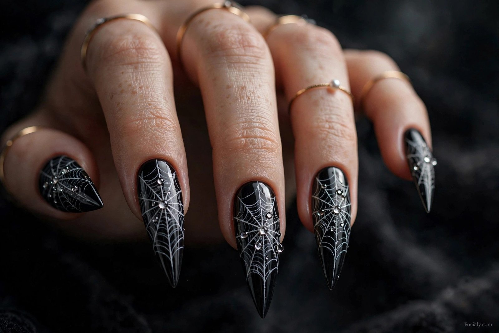 Black stiletto Halloween nails with white cobweb lace design