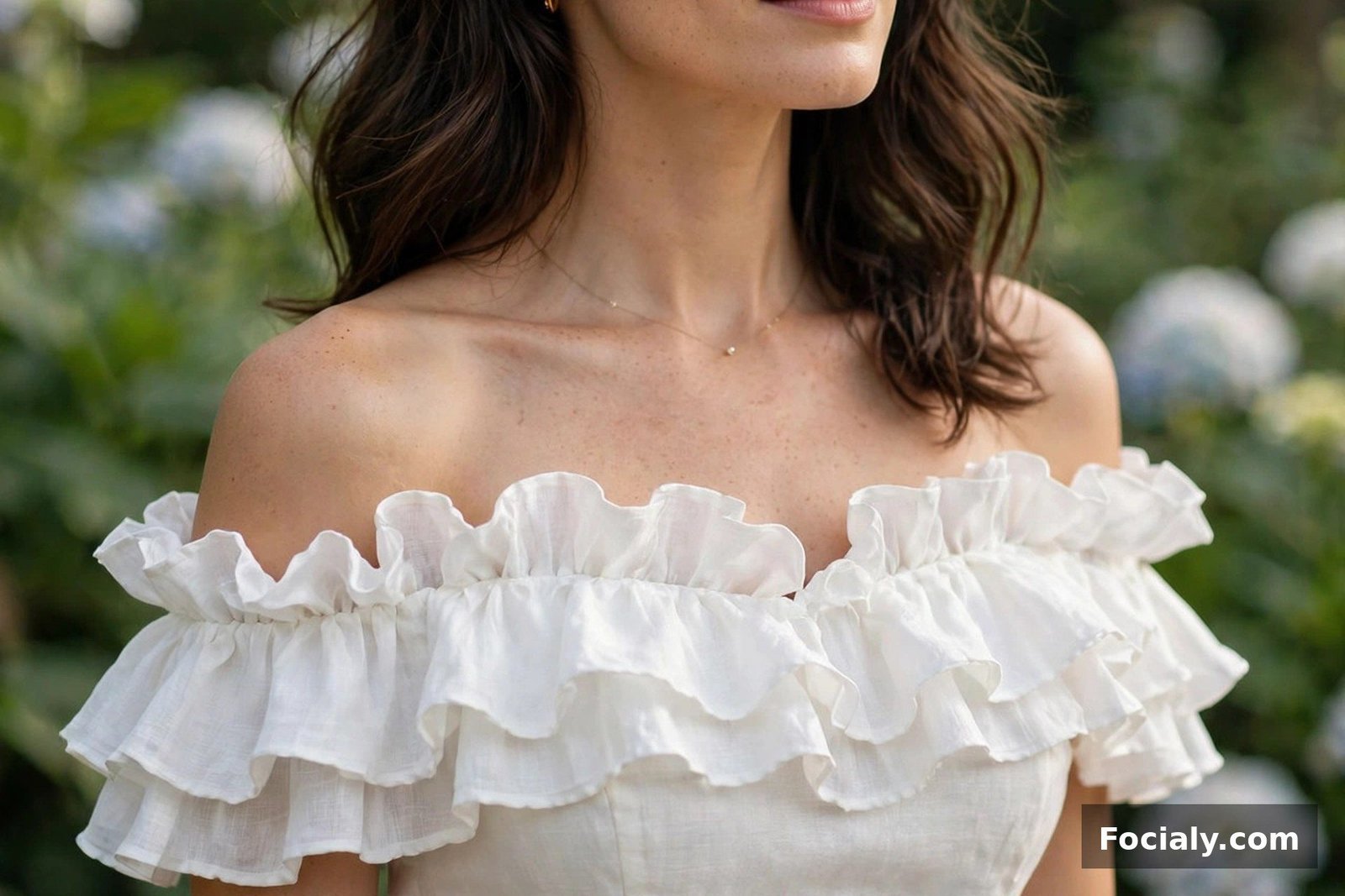 Woman in an off-shoulder white midi dress with ruffled neckline